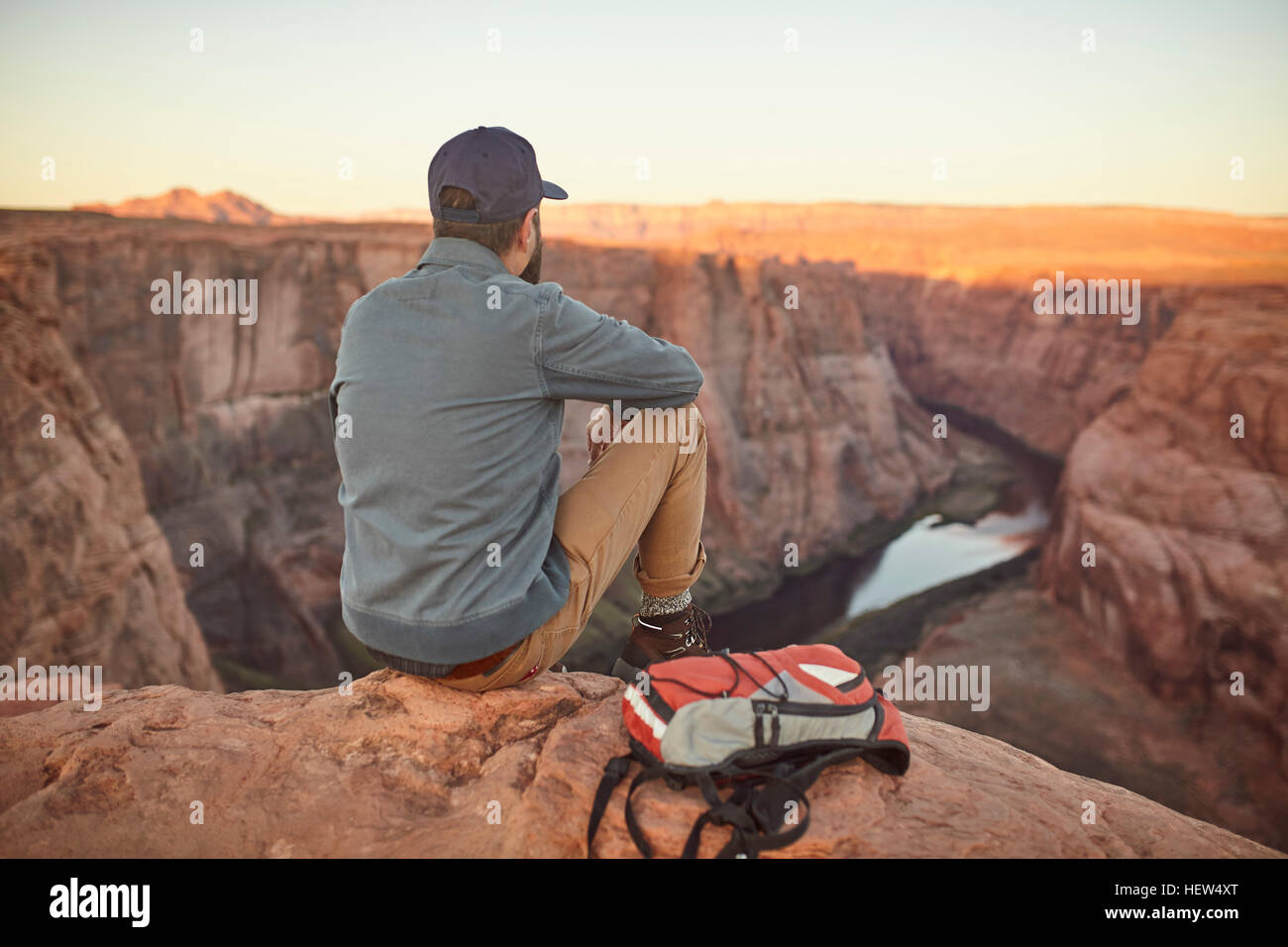 Man sitting rock hi-res stock photography and images - Alamy