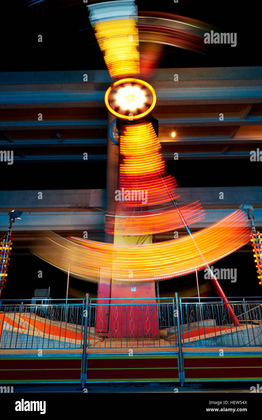 Fairground ride at night, long exposure Stock Photo