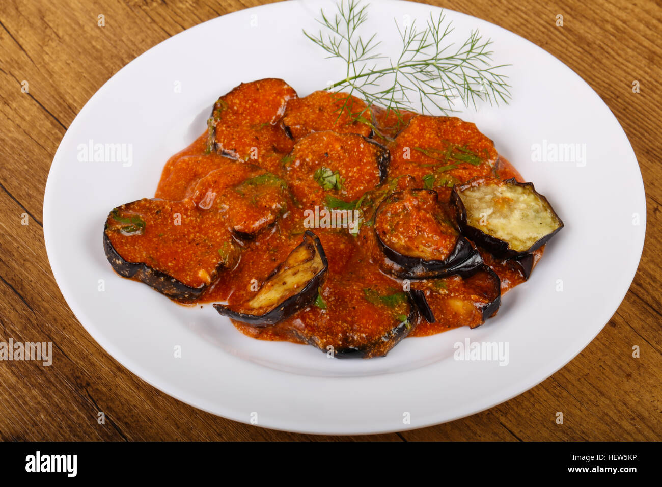 Grilled eggplant with tomato sauce and dill Stock Photo Alamy