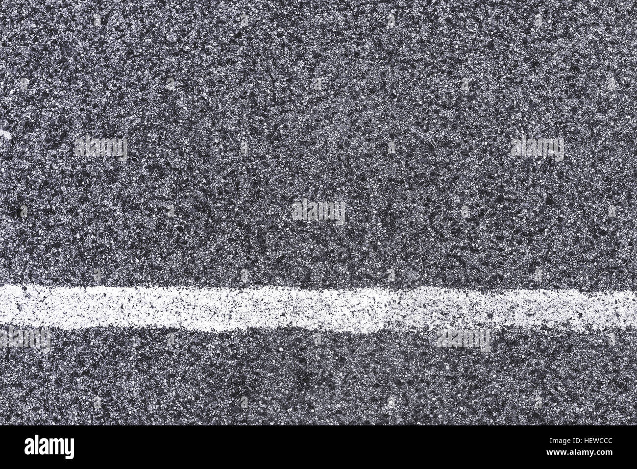 White line and asphalt road as simple background pattern, urban surface texture to be used for minimalistic design element Stock Photo