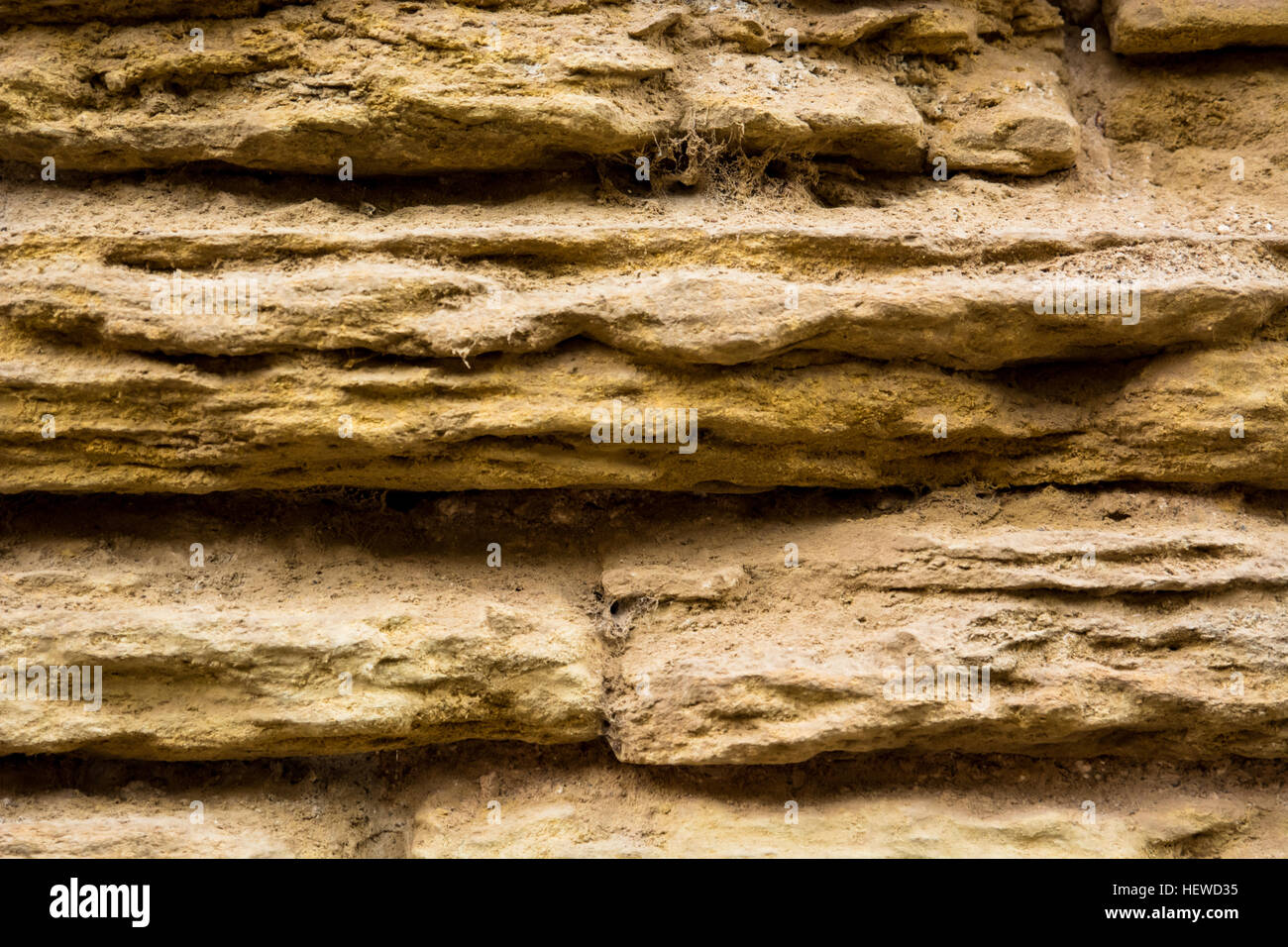 Detail of an ancient eroded stone wall Stock Photo - Alamy