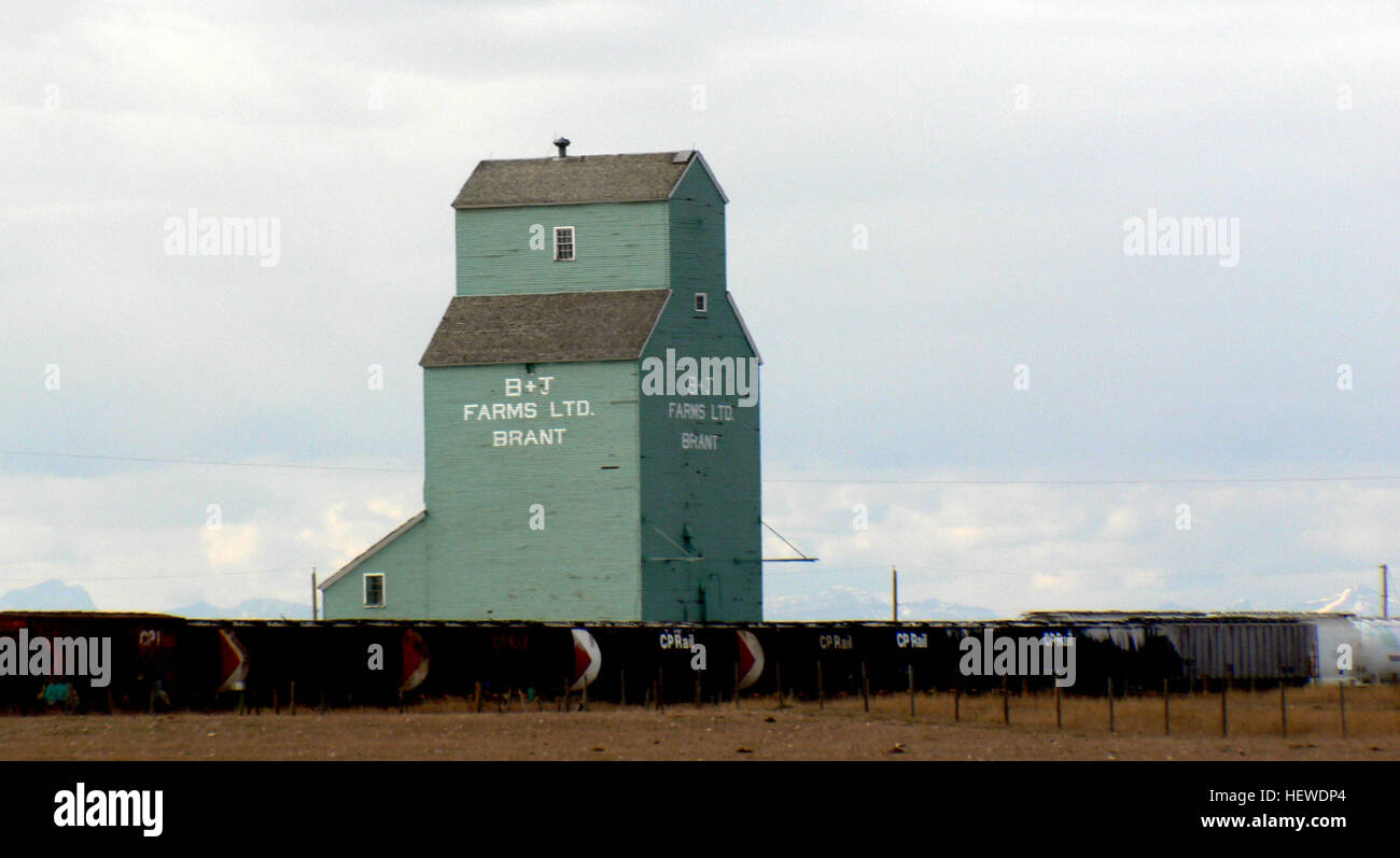 Brant is located 18 km west and 12 kilometres north of Vulcan. It is located on the CP main line which runs from Aldersyde to Kipp. This elevator was originally a Home Grain elevator, but changed owners to Searle, Federal and finally Alberta Wheat Pool, before being sold to B &amp; J Farms. Stock Photo