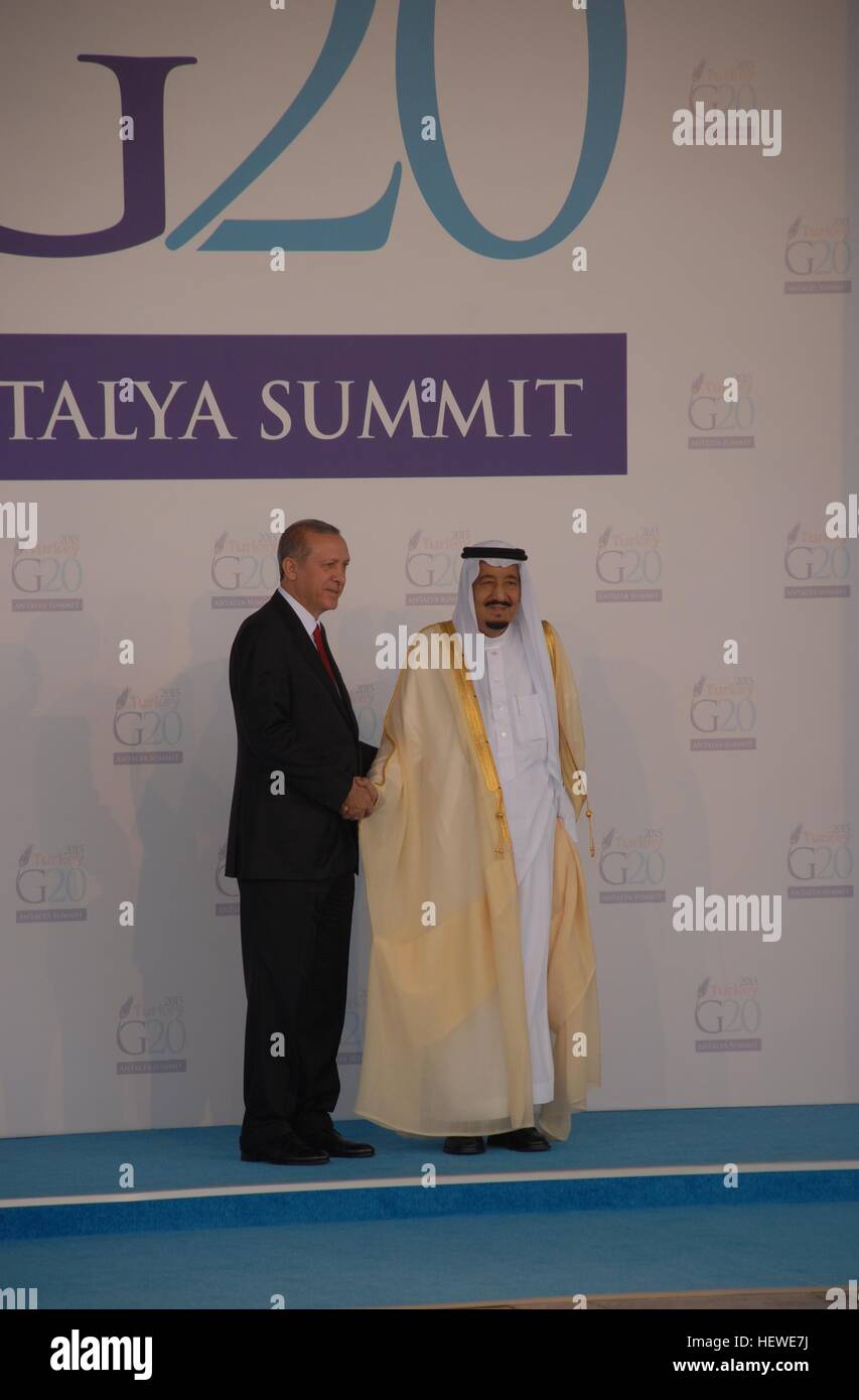 Turkish President Recep Tayyip Erdogan (L) greets Saudi Arabia King Salman as he officially arrives for the G20 Summit . Stock Photo