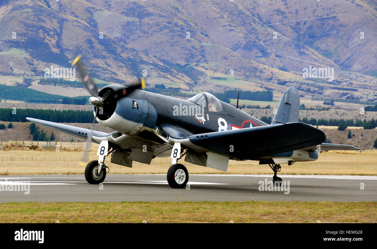 The Corsair was the first American aircraft to exceed 400 mph in straight and level flight in 1940. Of durable design, the type was in service in various parts of the world from 1942 until the late 1960's. The Corsair was the premier Navy and Marine fighter of World War II. Along with the Grumman Hellcat, it is credited with turning the tide of the Pacific air war by overwhelming the once-fearsome Japanese Zero fighter. Besides its role in air-to-air combat, Corsairs were used as fighter-bombers near the end of WWII and throughout the Korean War.   The bent-wing design allowed for shorter, str Stock Photo