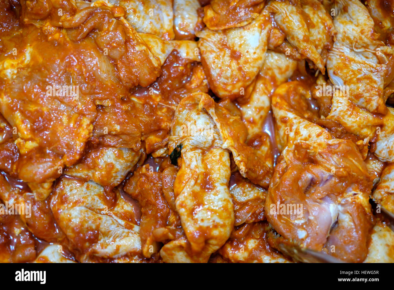Spicy fermented fresh chicken meat in Korean style Stock Photo Alamy