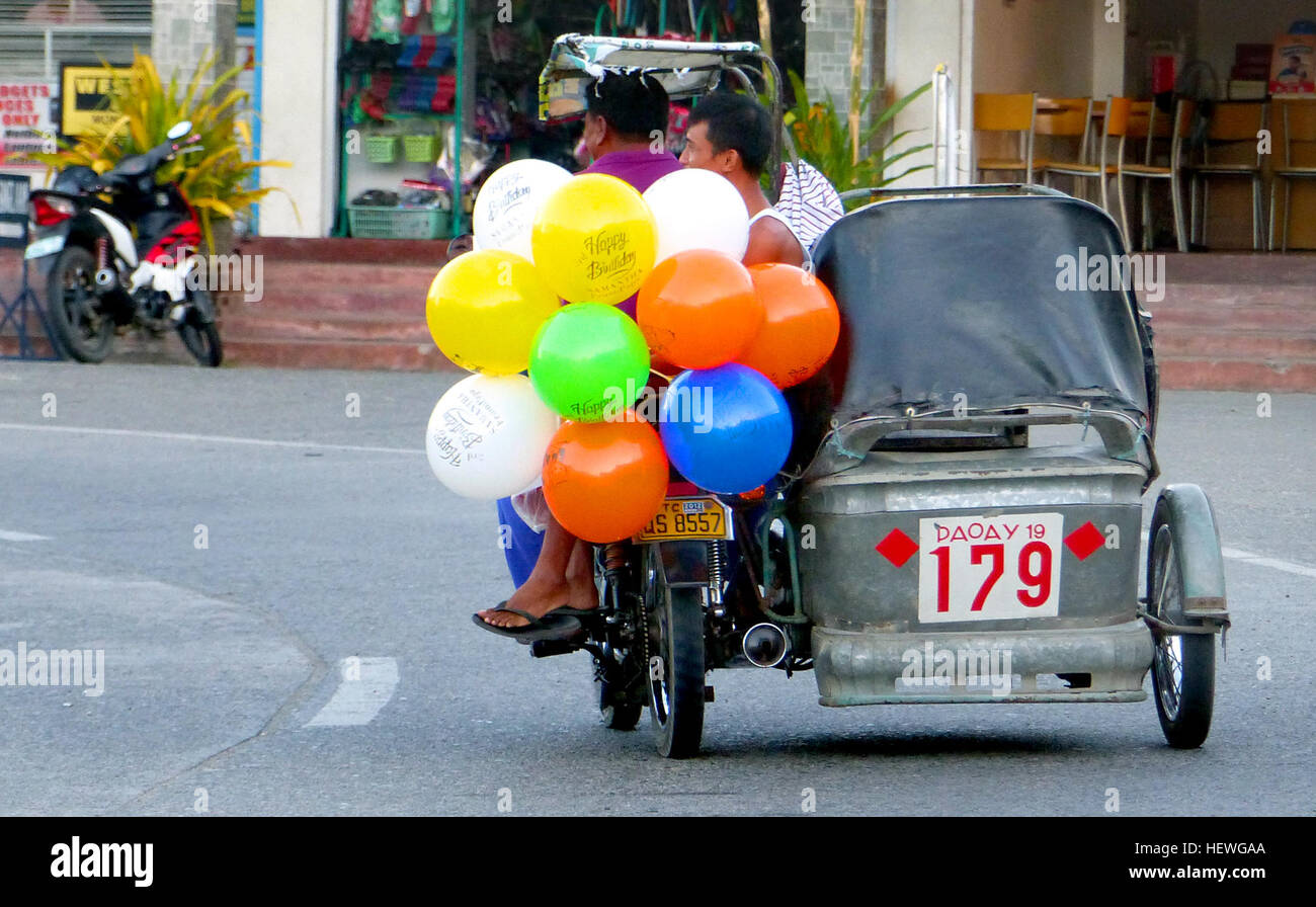 Motorized tricycles are a common means of passenger transport