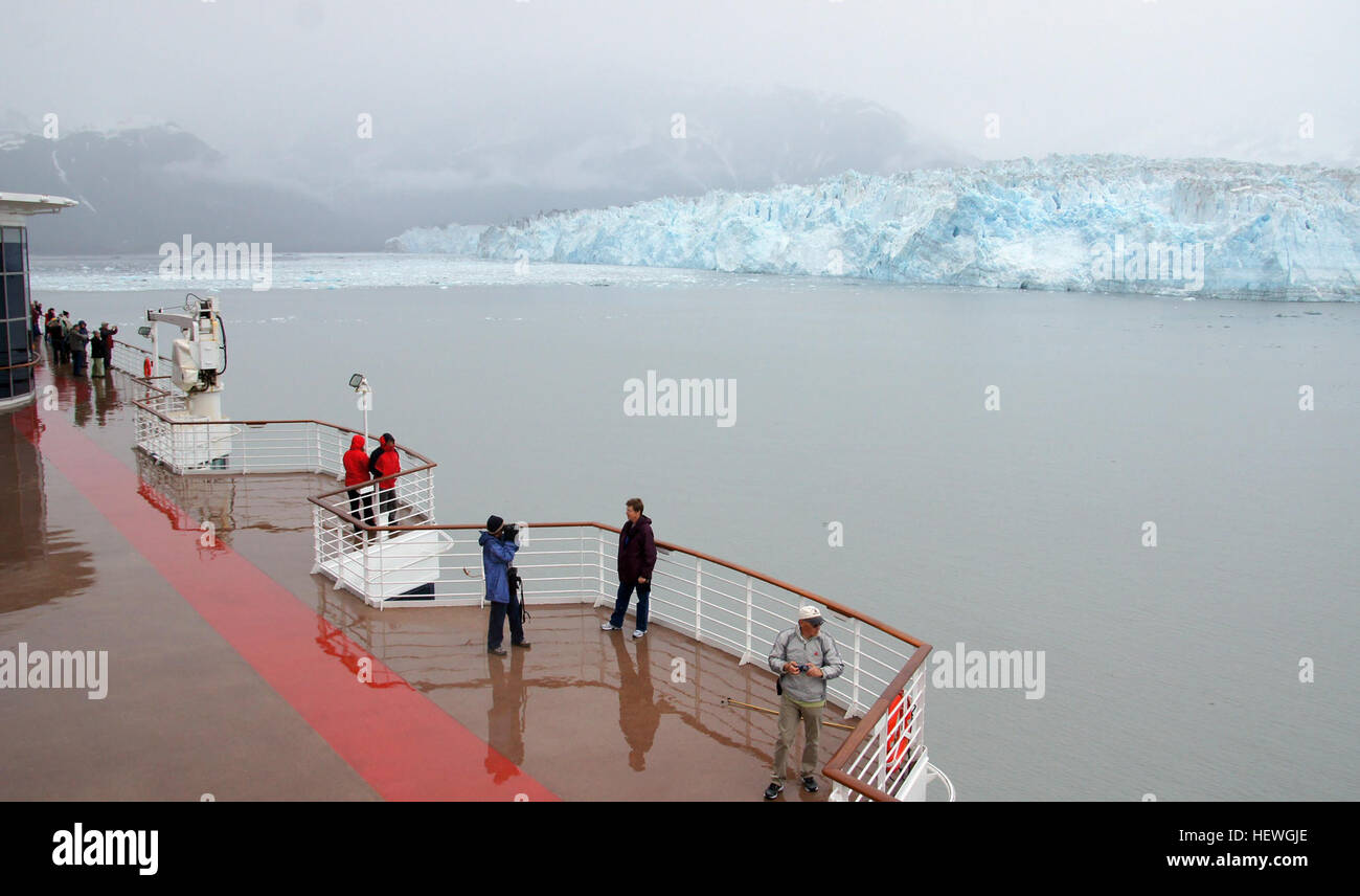 The longest source for Hubbard Glacier originates 122 kilometres (76 mi) from its snout and is located at about 61°00′N 140°09′W, approximately 8 kilometres (5 mi) west of Mount Walsh with an altitude around 11,000 feet (3,400 m). A shorter tributary glacier begins at the easternmost summit on the Mount Logan ridge at about 18,300 feet (5,600 m) at about 60°35′0″N 140°22′40″W. Before it reaches the sea, Hubbard is joined by the Valerie Glacier to the west, which, through forward surges of its own ice, has contributed to the advance of the ice flow that experts believe will eventually dam the R Stock Photo