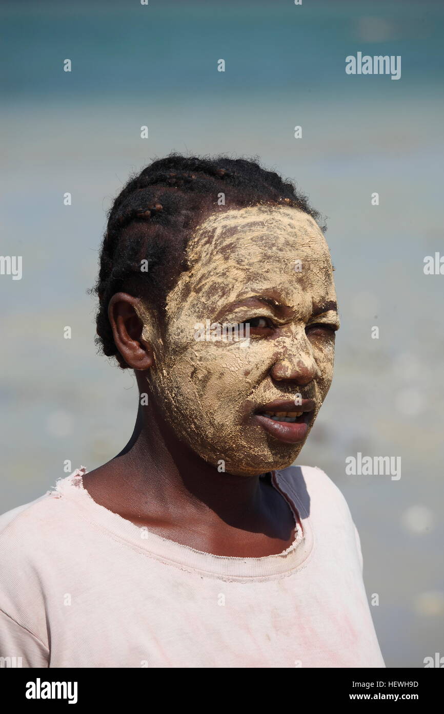 Lady wearing decorative facial sun protection on the beach at Ifaty Stock Photo
