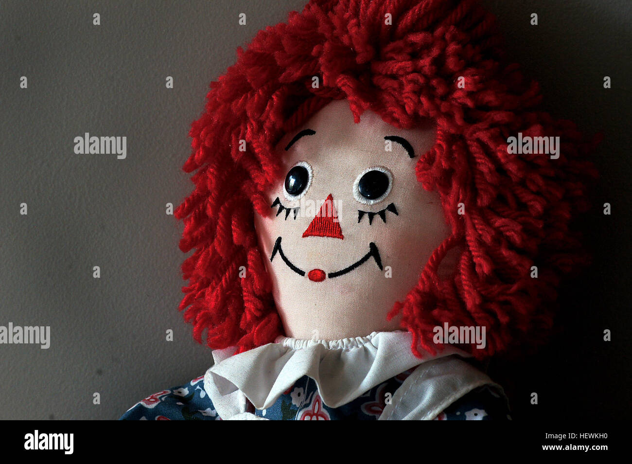 Raggedy Ann is a fictional character created by American writer Johnny Gruelle in a series of books he wrote and illustrated for young children. Raggedy Ann is a rag doll with red yarn for hair and has a triangle nose. Stock Photo