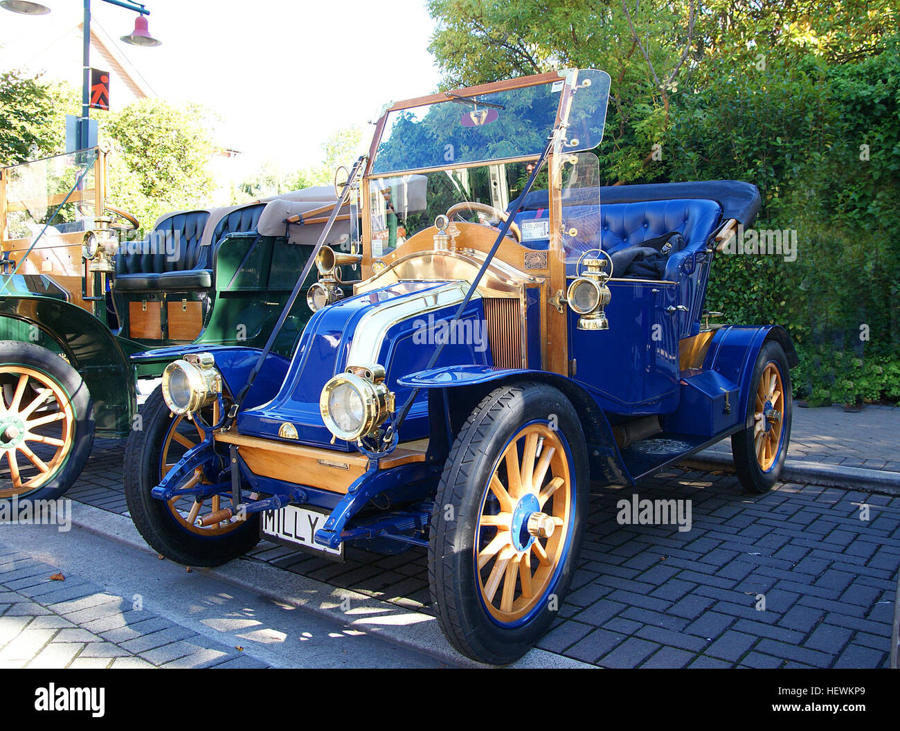 This photograph captures the essence of a vintage car show, highlighting the 1909 Renault AX, a classic example of early 20th-century automobile design. The event features a parade of classic cars, showcasing the evolution of early motor transport and the enduring appeal of vintage vehicles. Stock Photo