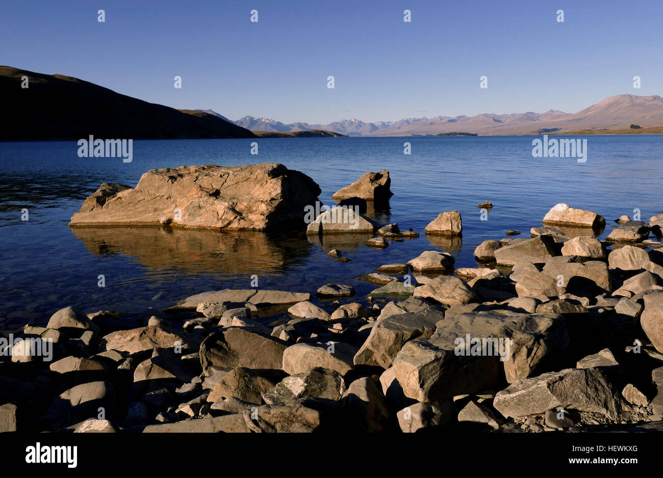 Lake Tekapo is the second-largest of three roughly parallel lakes running north–south along the northern edge of the Mackenzie Basin in the South Island of New Zealand. Stock Photo