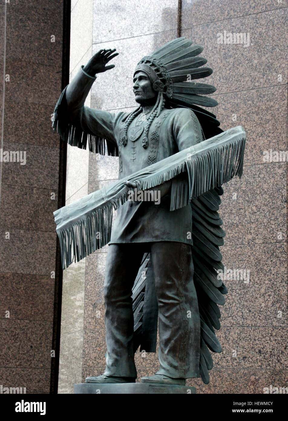 This statue is of Sitting Eagle or John Hunter is located on the corner of 7 Avenue and 6 Street SW in downtown Calgary, Alberta. Stock Photo