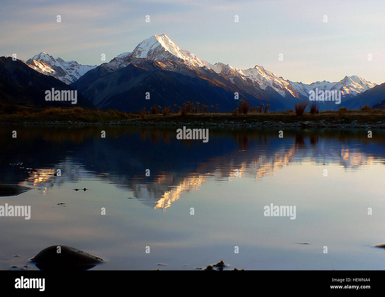 Aoraki/Mount Cook National Park in New Zealand is renowned for its rugged terrain, glaciers, and 19 peaks over 3000 meters. It is home to the highest mountain in New Zealand, Mount Cook, and offers stunning landscapes of ice and rock. Stock Photo