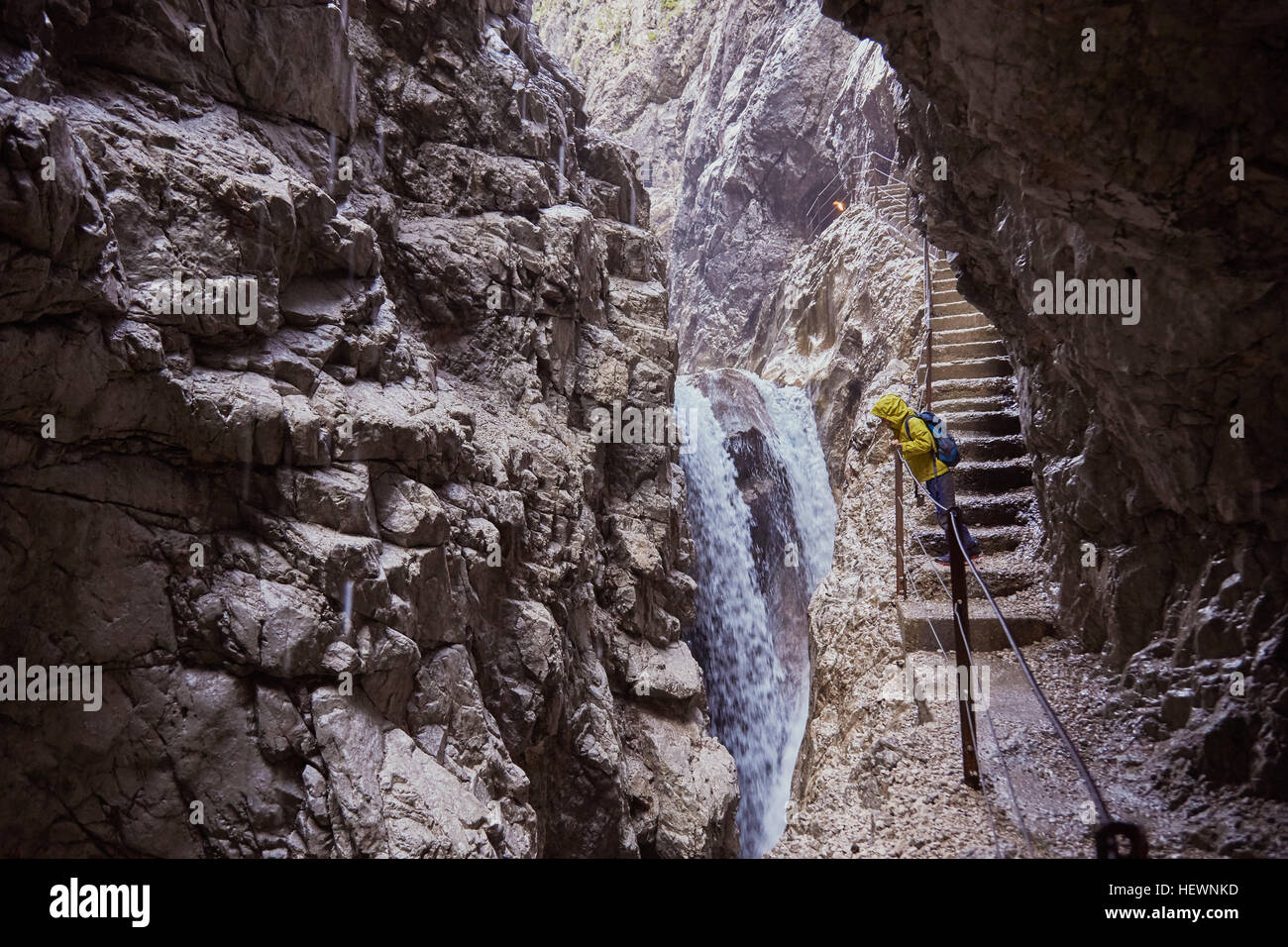 Young boy standing on stone steps, looking at view, Höllental, Zugspitze, Garmisch-Partenkirchen, Bavaria, Germany Stock Photo