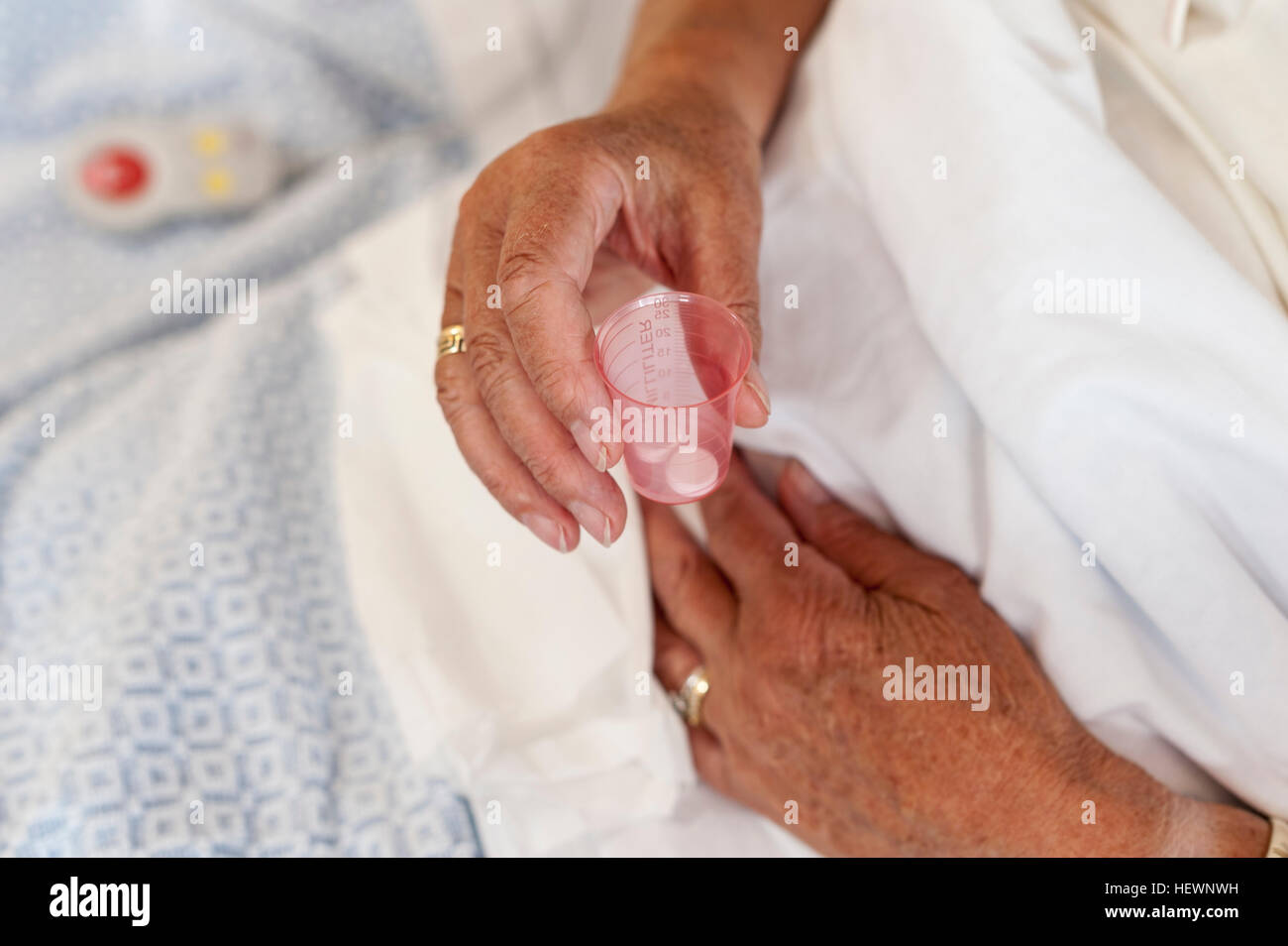 Cropped view of patient's hand holding pills Stock Photo