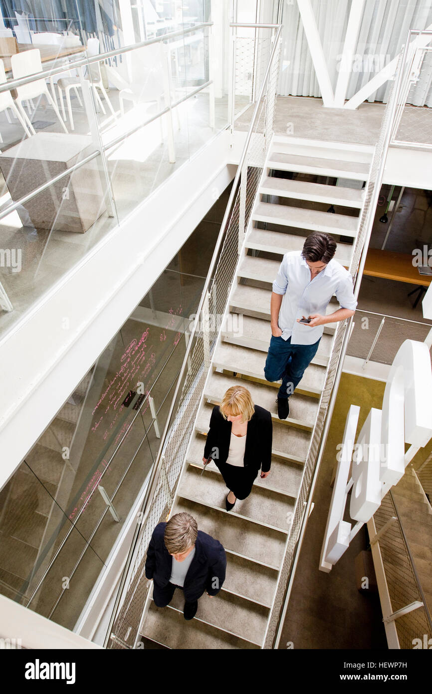 High angle view of business people going down stairs Stock Photo