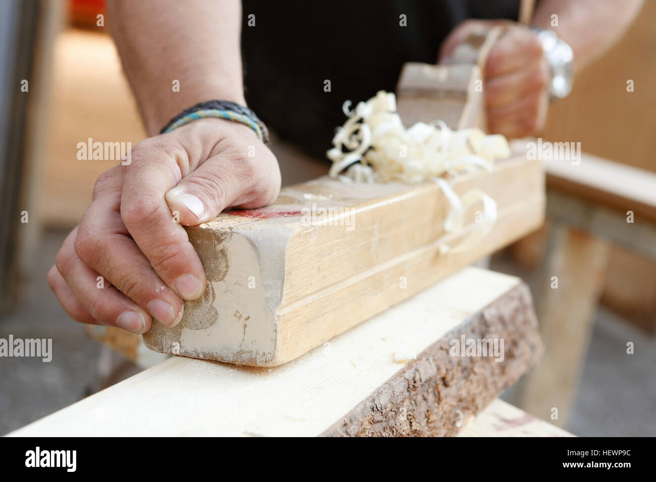 Cropped view of man using wood plane Stock Photo