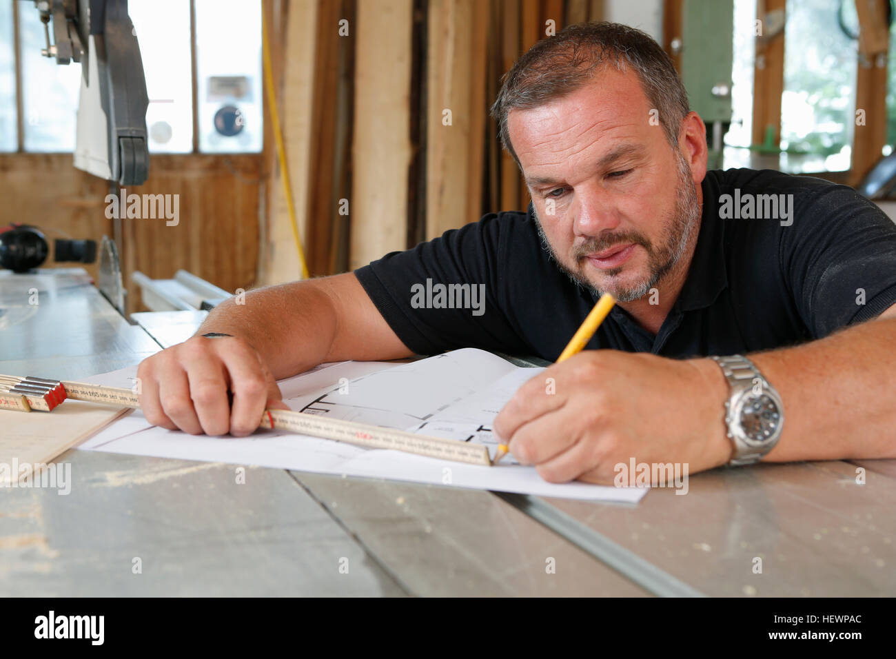 Man drawing blueprint Stock Photo