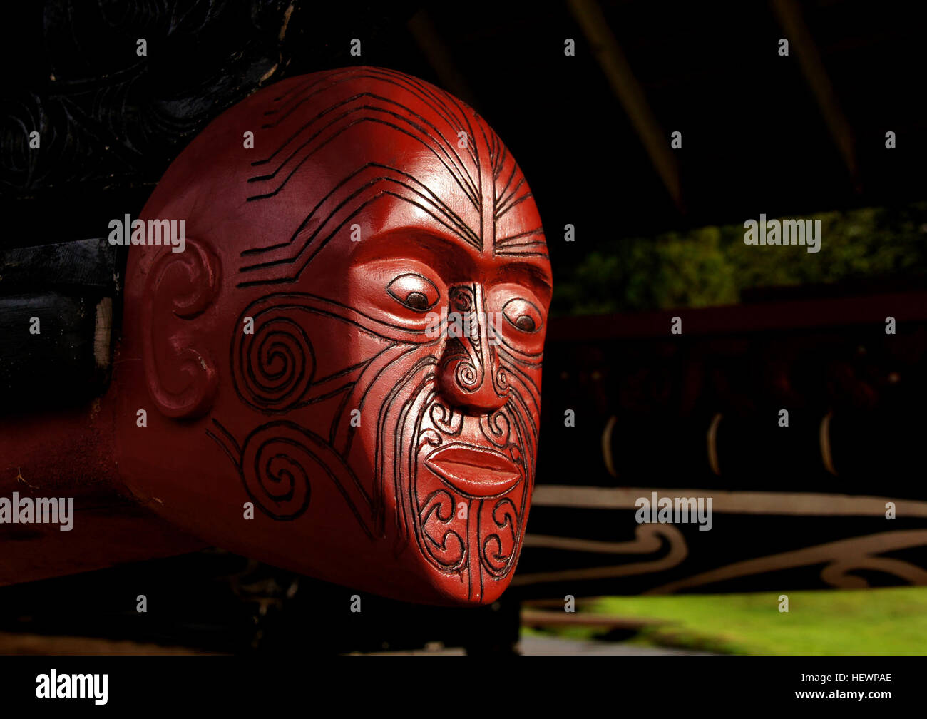 Above is a carved figurehead of the waka taua (war canoe) Ngatokimatawhaorua, 'launched each February 6 at the celebrations of the Treaty of Waitangi, and on other special occasions'.  Maori carving is spectacular, diverse and deeply symbolic and reverent of the people's ancestors. The tradition had been dying out but both the tribes and the New Zealand government have worked together to bring it back and are teaching the new generations the old carving artistry. The new generation is more involved now, not just in carving but the traditions of weaving and haka (dance) and we can hope to see m Stock Photo