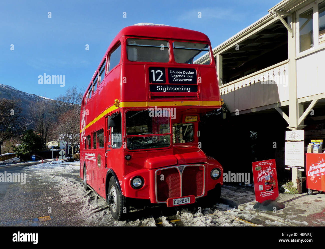 The Routemaster bus was an icon which has run in London for over 50 years. The design of this bus was way ahead of its time and just right for the travelling conditions in London. It outlived much newer buses due to its flexibility, speed and build quality, only being replaced on age and cost.   This fun trip in a historic London Double Decker bus is the best introduction to both the old and the new in Arrowtown. Our genuine British double-decker bus leaves downtown Queenstown every morning to take you on a birds-eye view tour of the spectacular countryside on the way to the quaint gold mining Stock Photo