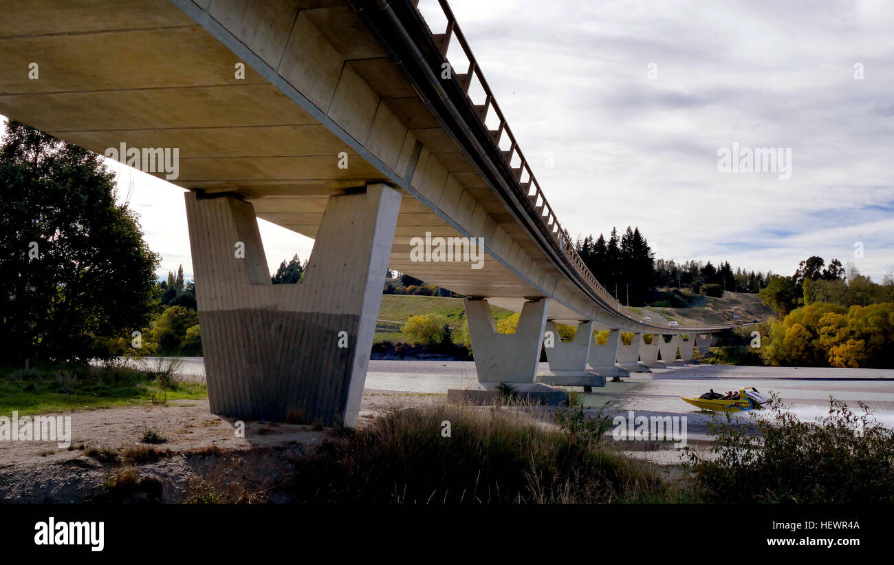 This sweeping bridges spans The Shotover River. Located on SH6, the main road from Queenstown to Cromwell. Stock Photo