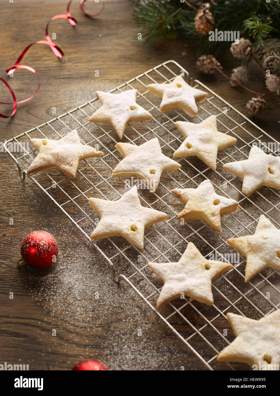 Christmas star biscuits on cooling rack Stock Photo