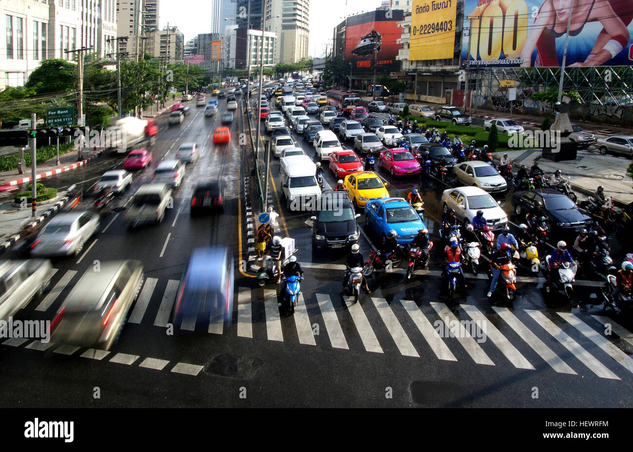 There are more than 7.5 million registered vehicles on the roads of Bangkok, almost one for every resident of a city of nine million people. It is often called “rush hour”, only it lasts most of the day. Trucks, tractors, buses, motorcycles, sedans, auto rickshaws make Bangkok a long-standing poster-child for urban gridlock. The city of 11 million is driving itself to a standstill as this congestion is expected to get a lot worse in 2013 Stock Photo
