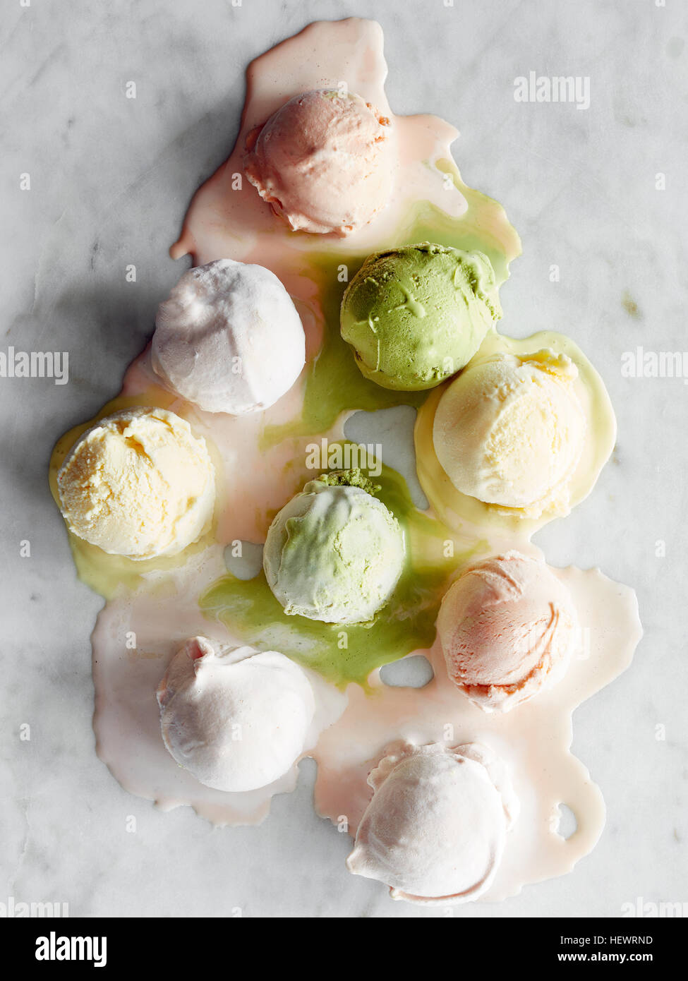 Scoops of icecream melting on marble top Stock Photo Alamy