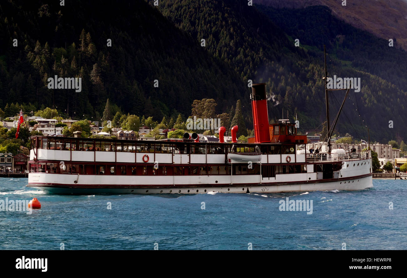 The TSS Earnslaw is a 1912 Edwardian vintage twin screw steamer plying the waters of Lake Wakatipu in New Zealand. It is one of the oldest tourist attractions in Central Otago, and the only remaining commercial passenger-carrying coal-fired steamship in the southern hemisphere. Stock Photo