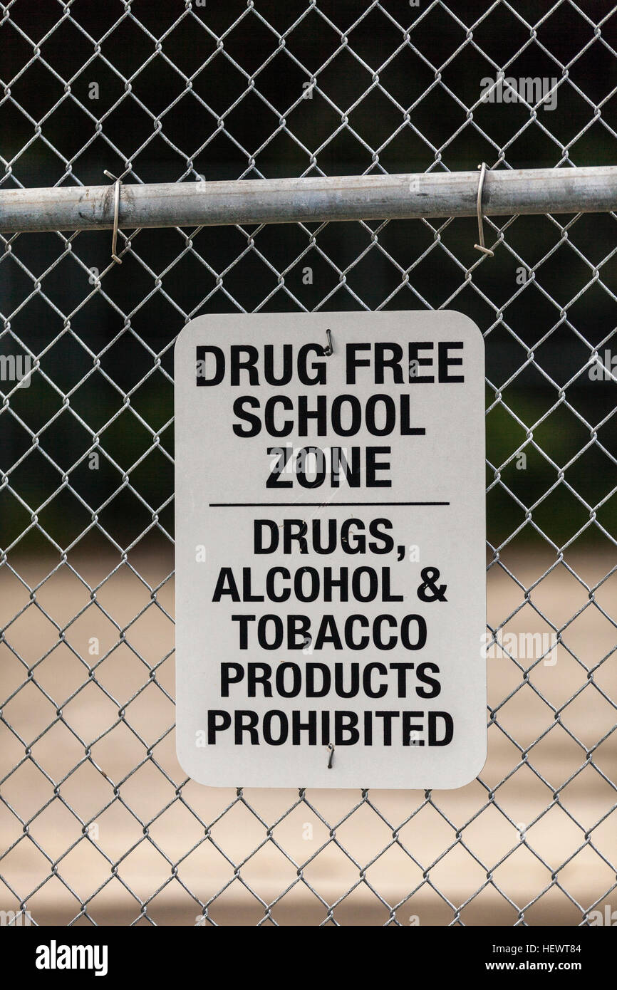 Warning sign on school wire fence, Seldovia, Kachemak Bay, Alaska, USA Stock Photo