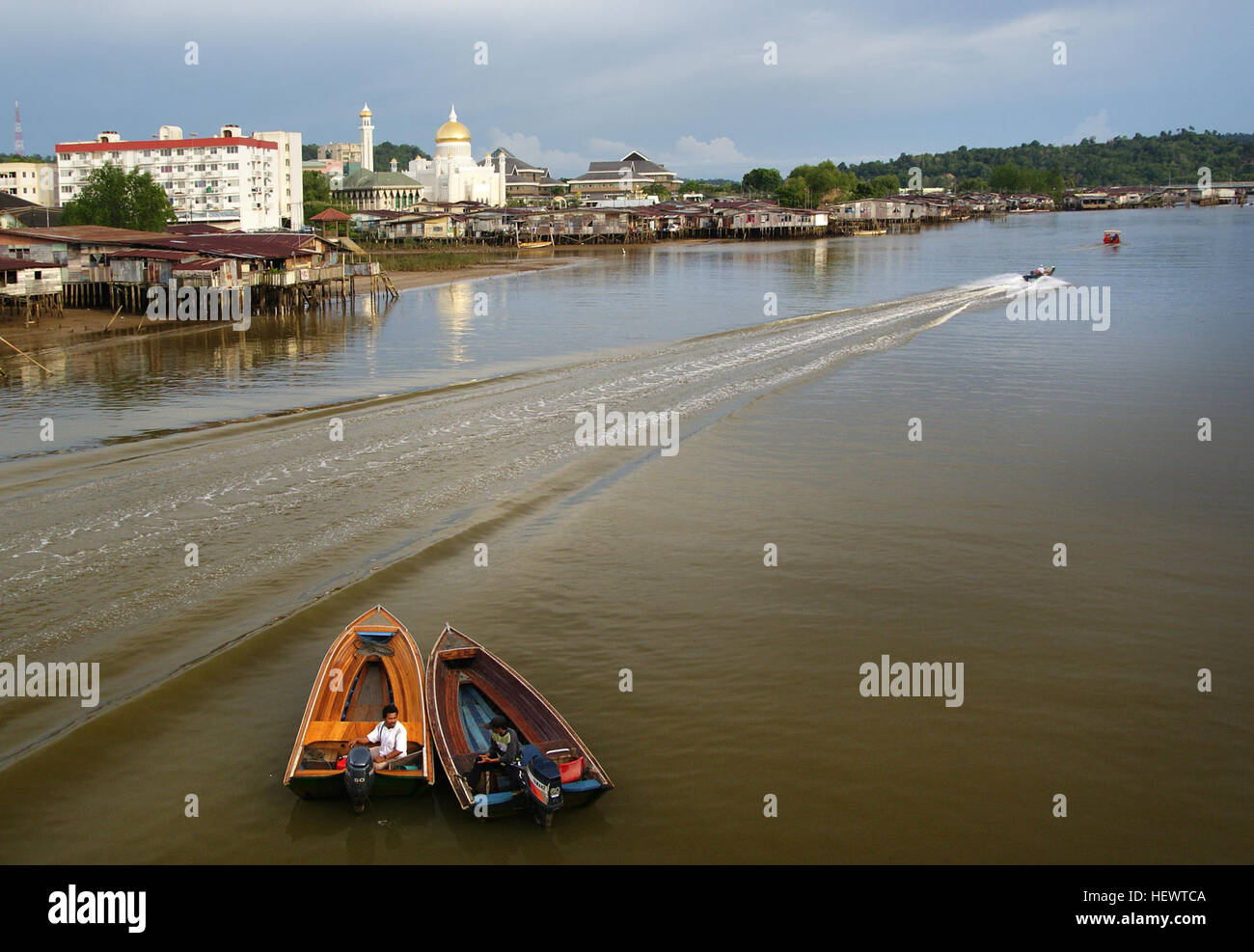 Water taxis ply the Brunei River, linking Bandar Seri Begawan's waterfront with the sultanate's most renowned water village, Kampung Ayer. Be prepared to haggle a bit over the fare. Speedboats link Bandar Seri Begawan with Bangar, the main town in Temburong District. Stock Photo