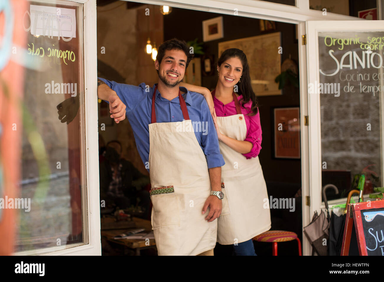 Restaurant owners standing at entrance of cafe, Palma de Mallorca, Spain Stock Photo