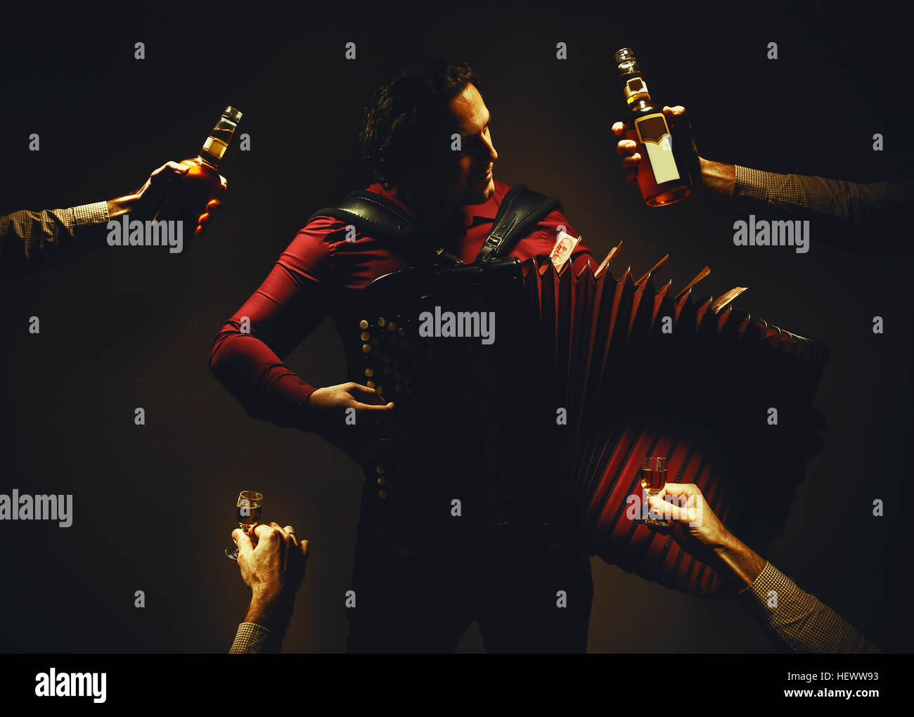 Modern accordion player posing with his chromatic harmonica type