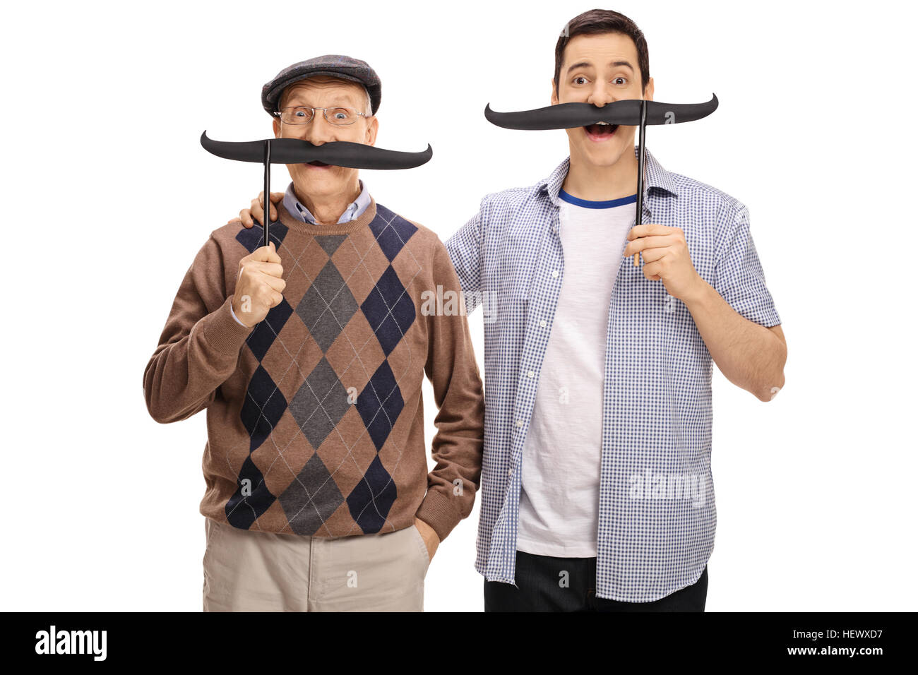 Senior and a young man posing with big fake moustaches isolated on white background Stock Photo