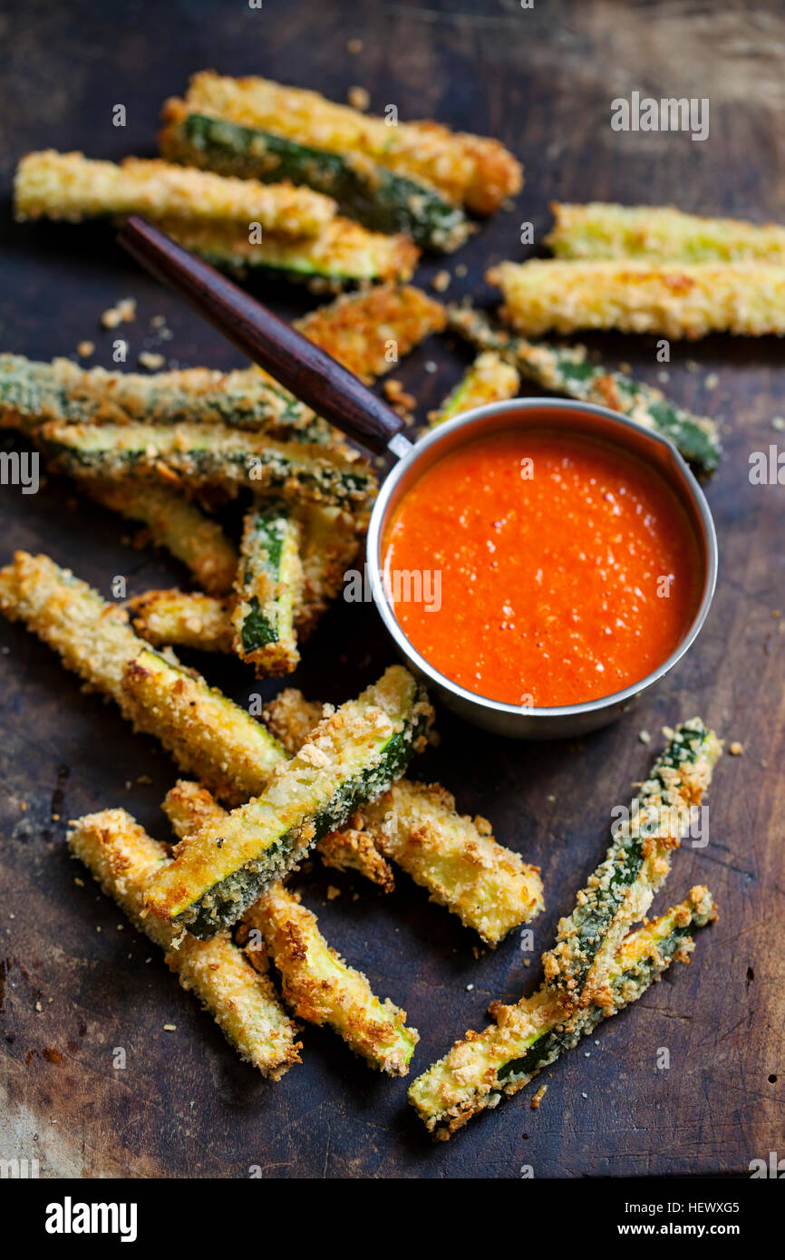 Zucchini fires with roast pepper and tomato sauce Stock Photo Alamy