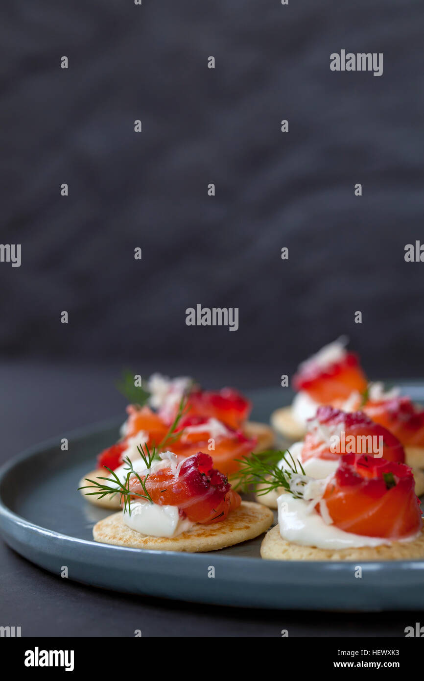 Party blinis with beetroot cured salmon, cream and horseradish Stock