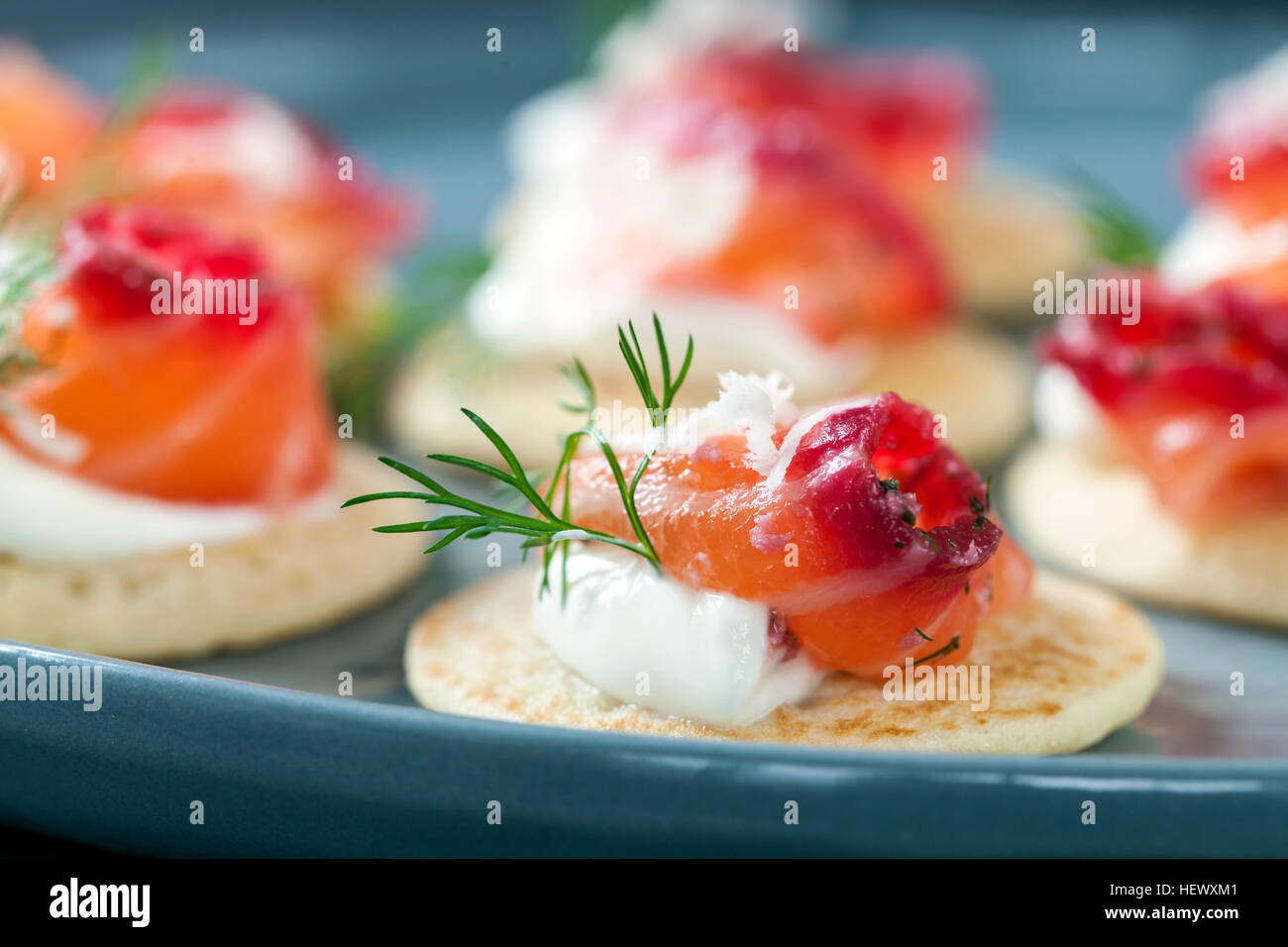 Party blinis with beetroot cured salmon, cream and horseradish Stock