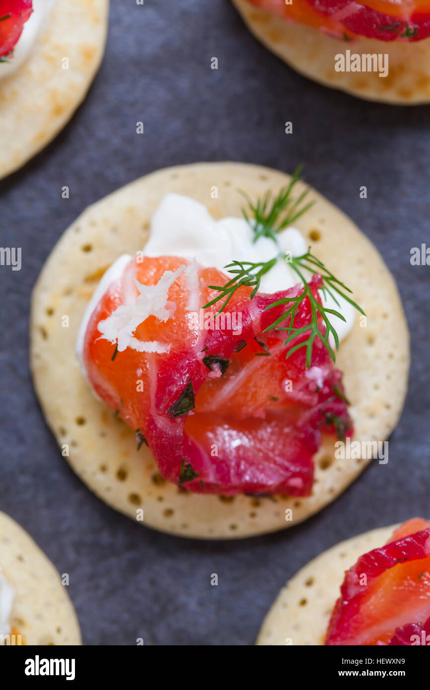 Party blinis with beetroot cured salmon, cream and horseradish Stock