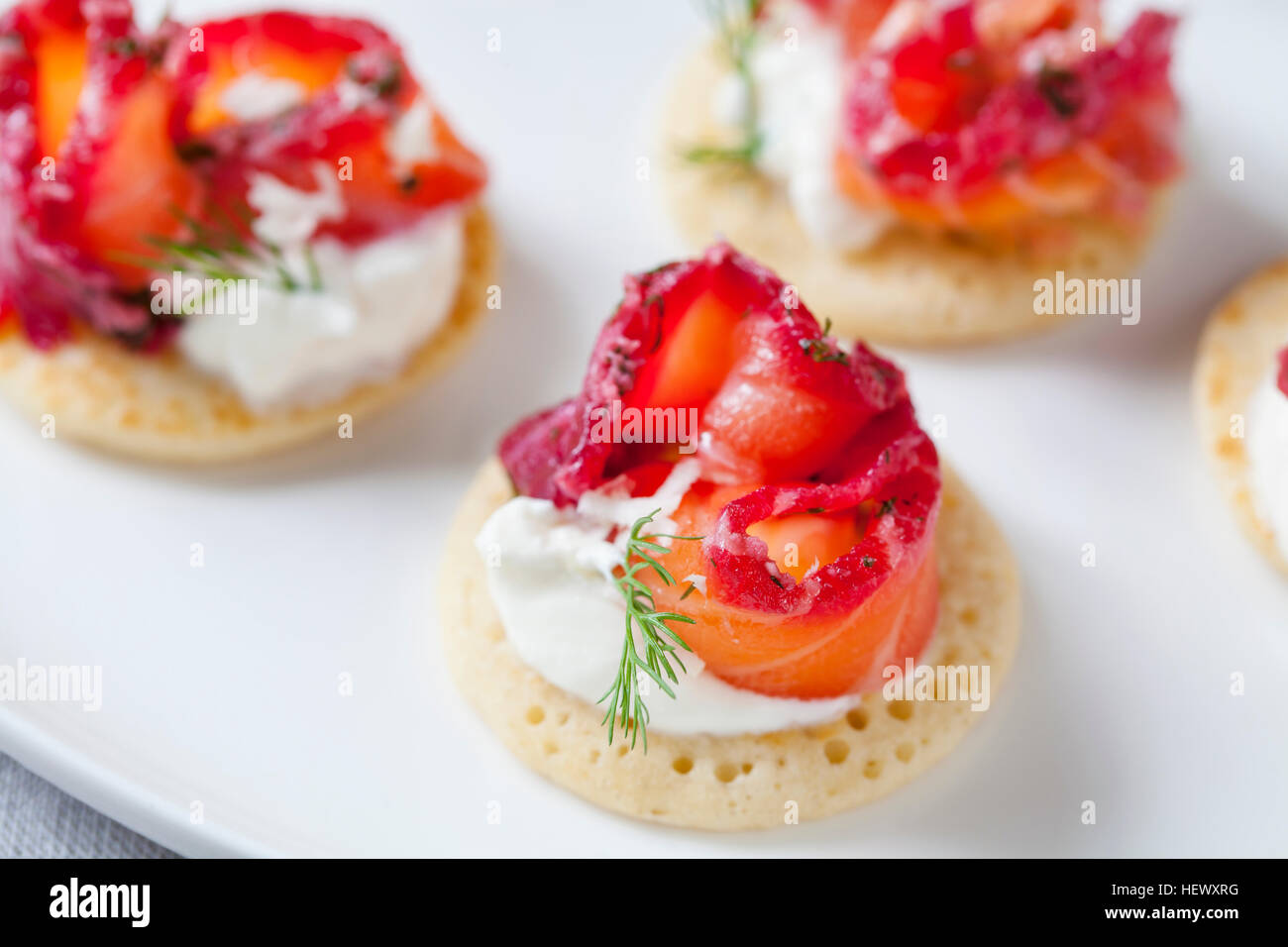 Party blinis with beetroot cured salmon, cream and horseradish Stock