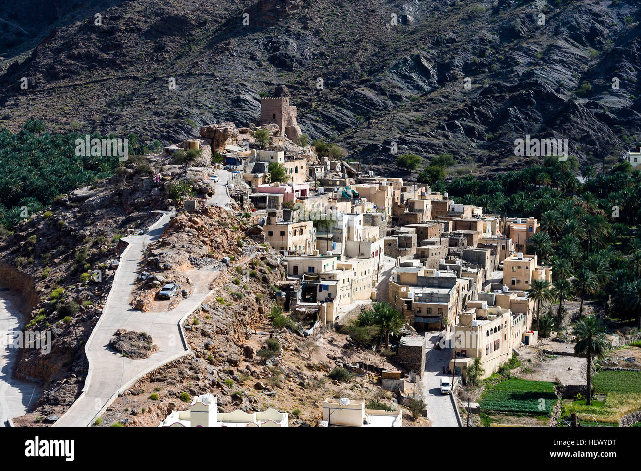 A mountain village stacked on terraced streets in a desert mountain valley. Stock Photo
