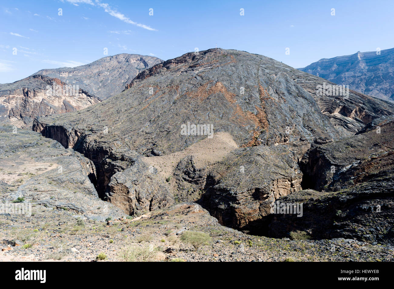 A jagged and winding canyon eroded by a river in a rocky desert. Stock Photo