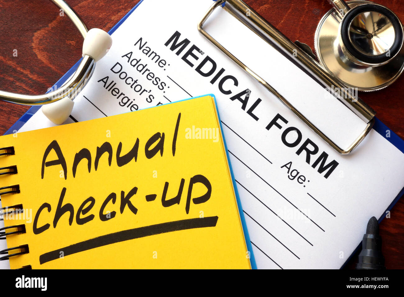 Annual check-up in a note and medical form. Stock Photo