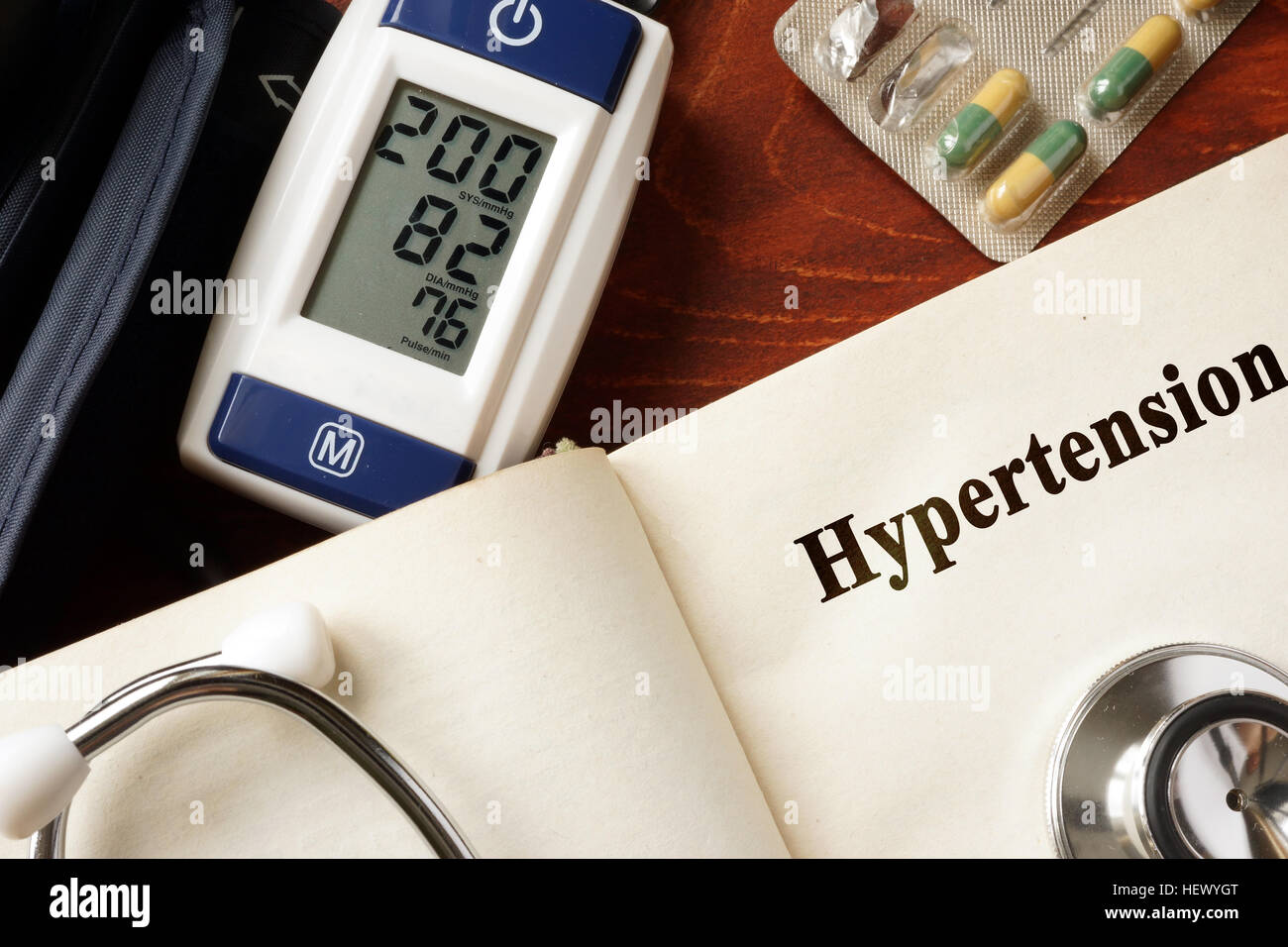 Hypertension title in a book and stethoscope. Stock Photo