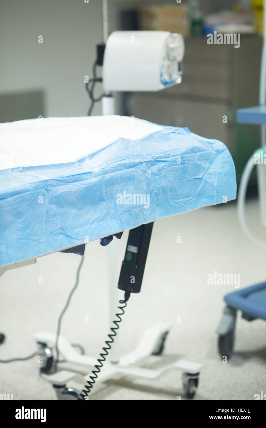 Hospital surgery bed in operating theater emergency room prepared for surgeon to operate Stock
