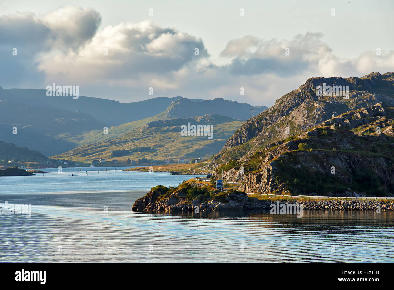 Norway road on coastline of a fjord. Nordic sunny summer day. Lofoten Norway islands. Stock Photo