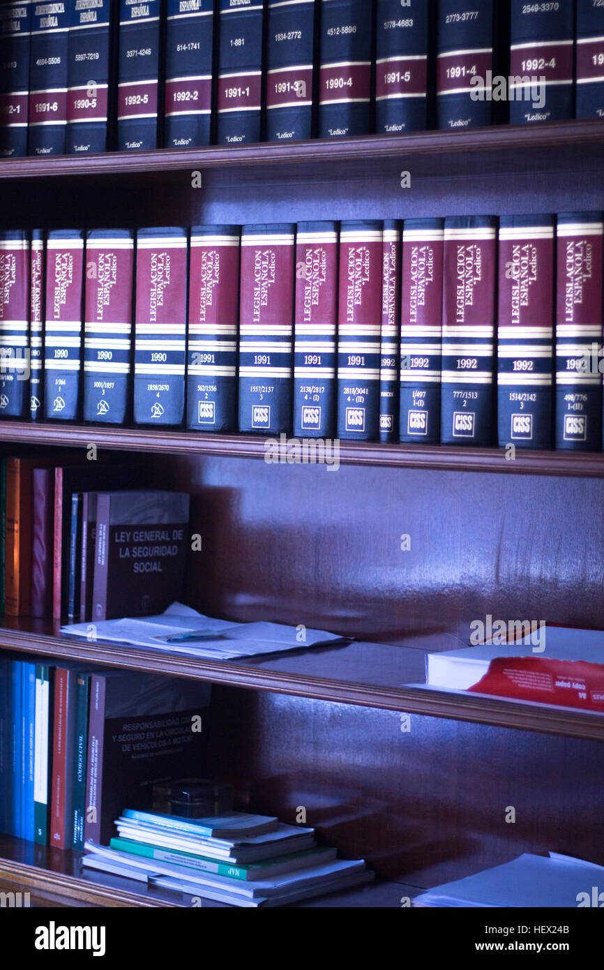Old legal books law reports on shelves of law offices of attorneys and lawyers in judicial reference library. Stock Photo