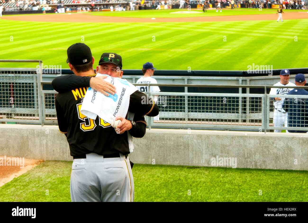 June 3, 2014. San Diego, California.  Charlie Morton relief pitcher for the Pittsburgh Pirates hugging the pitching coach in the bullpen in Petco fiel Stock Photo