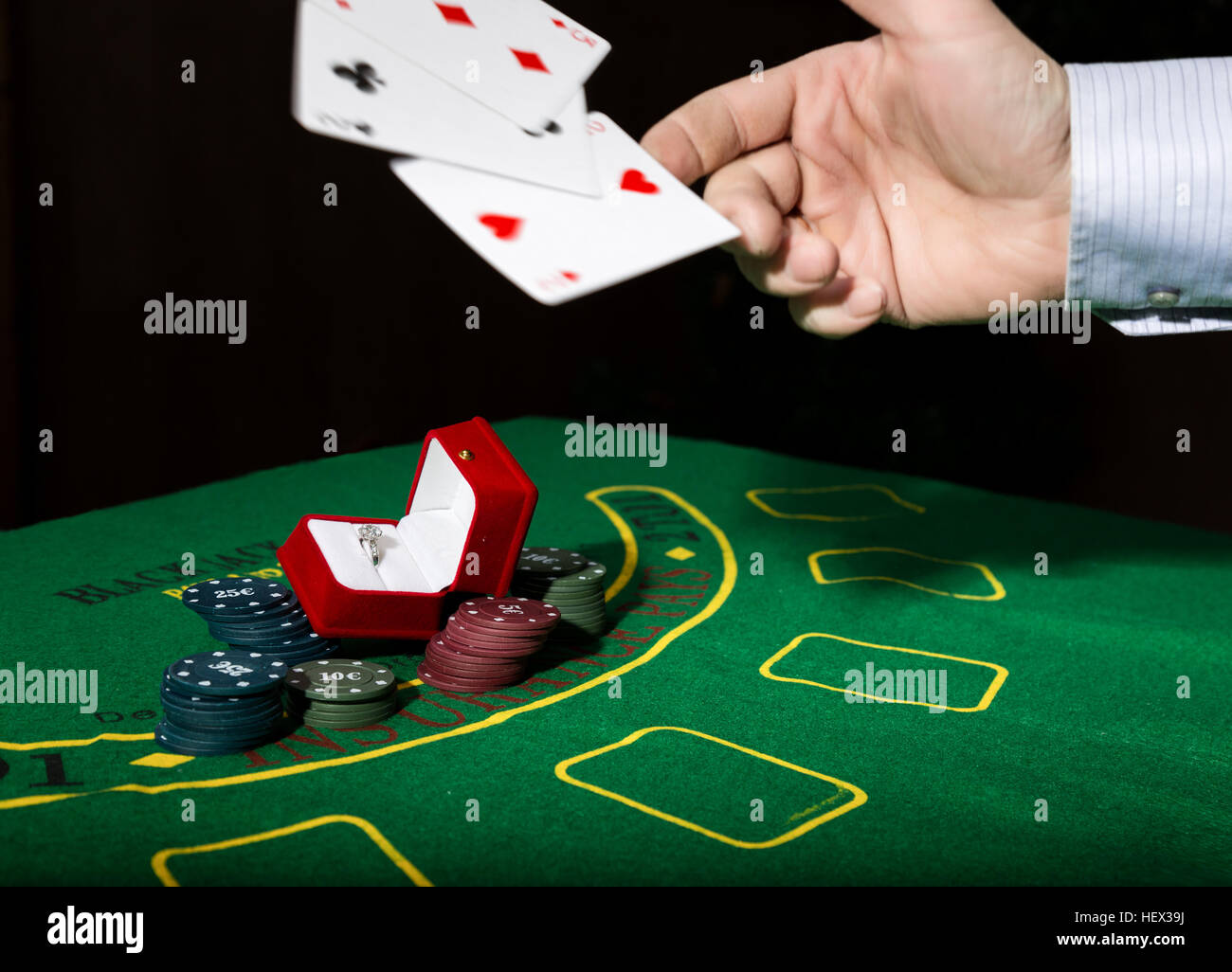 Casino Chips And A Precious Ring On Green Poker Table Background Man Throws Cards With Losing Combination Stock Photo Alamy