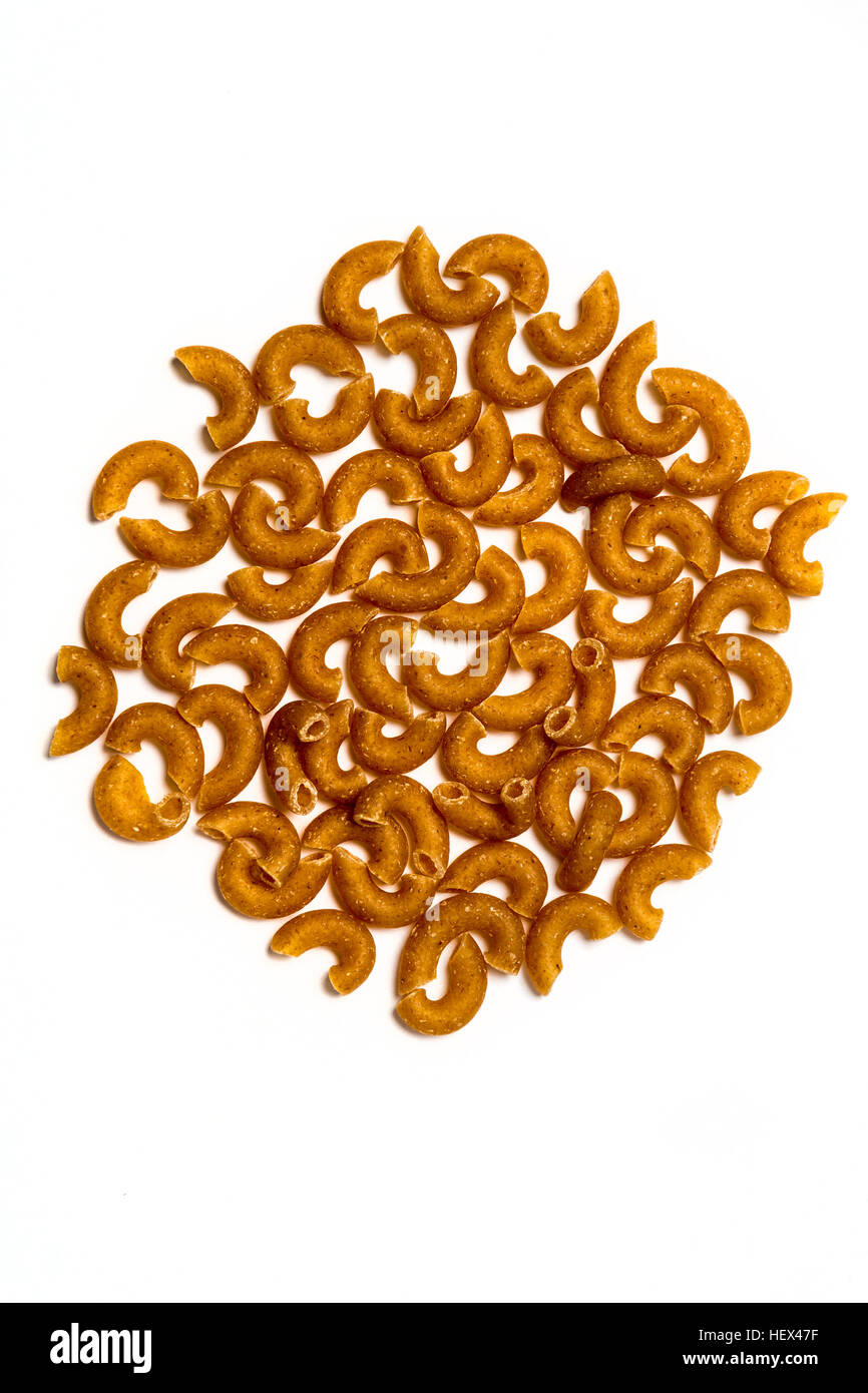 Whole wheat pasta isolated on white background Stock Photo - Alamy
