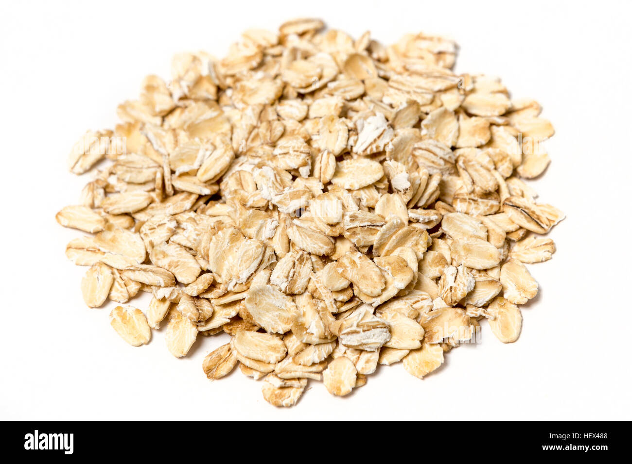 Pile of rolled oats isolated on white background Stock Photo